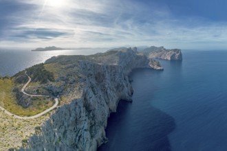 Aerial panorama landscape view of the curving road and rugged Cap de Formentor in northwestern