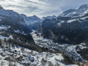Lauterbrunnen Valley and Snowy Mountains on Sunny Winter Day. Swiss Alps. Switzerland. Aerial View.