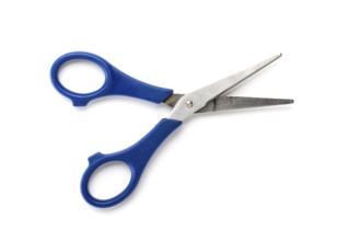 Old used children scissors, isolated on white
