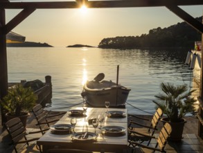 Set table of a restaurant, boat in the harbour of Pomena, island Mljet, Dubrovnik-Neretva,