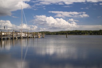 View over the Scharmützelsee with jetty and marina, long exposure, Wendisch-Rietz, Brandenburg,