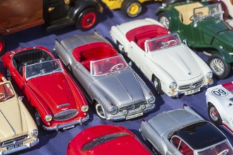 Old metal convertible toy cars at a flea market, Germany, Europe