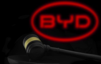 Court gavel in front of the BYD logo. BYD Auto Co Ltd is the main automotive subsidiary and brand