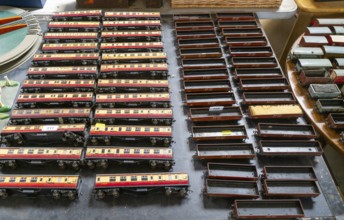 Model railway toy train set items on display for sale at auction room, UK