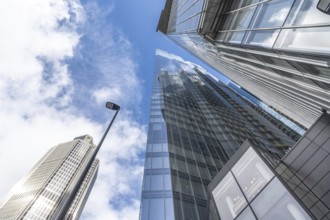 Low angle view of modern skyscrapers in london's financial district, showcasing their towering