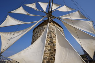 Wide sails on a stone windmill, blue sky in the background, windmill, Antimacheia, Kos, Dodecanese,