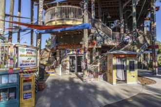 Tacky Jacks bar and restaurant decorated with strips of brightly colored stickers where guests