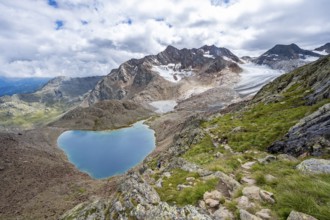 Dramatic high mountain landscape, view of Vogelhüttensee mountain lake and Übeltalferner glacier,