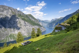 Blomberg Gård, historic mountain farm with grass roof on a steep mountainside above the