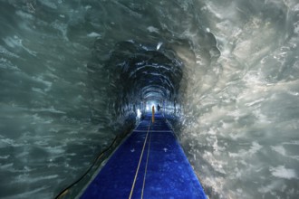 Artificial ice cave through the glacier ice, Mer de Glace, Montenvers, Chamonix, Haute-Savoie,