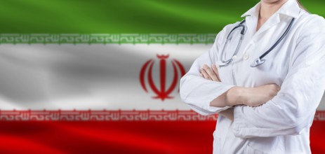 Doctor with crossed arms on Iran flag. Iran health and care concept. Female doctor on Iran flag