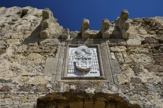 Coat of arms of the Grand Master del Carretto, close-up of a stone relief with coat of arms on an