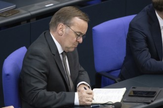 Berlin, Germany - 24.6.2025: Defence Minister Boris Pistorius takes notes during the government