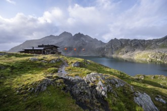 Mountain hut Wangenitzseehütte in the morning light, mountain landscape with mountain lake