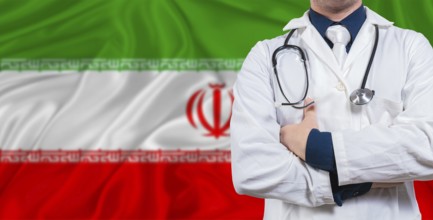Male doctor with stethoscope on Iran flag. Doctor holding stethoscope on Iran flag
