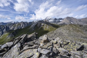 Summit of Kastenegg, view of picturesque mountain landscape with snow-covered summit of the