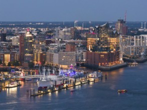 Aerial view of the Landungsbrücken in the harbour at blue hour with the Elbphilharmonie in the