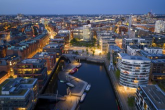Aerial view of the Speicherstadt Hamburg with Magellan Terraces at Sandtor harbour at blue hour,