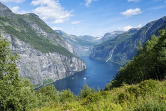 View of the idyllic fjord landscape of the Geirangerfjord at Blomberg Gård, near Geiranger, Møre og