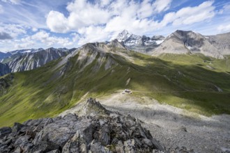 Summit of Kastenegg, view of picturesque mountain landscape with snow-covered summit of the