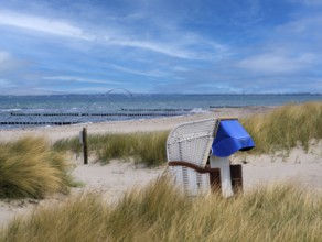 Beach chair dunes Strandwarder in front of Fehmarn bridge Heiligenhafen Baltic Sea Germany