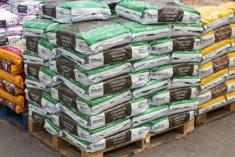 Melcourt composted fine bark bags stacked up at Lowden garden centre, Wiltshire, England, UK
