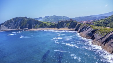 Breathtaking aerial view of zumaia's unique flysch coastline, showcasing its dramatic cliffs and
