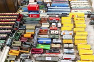 Model railway toy train set items on display for sale at auction room, UK