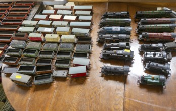 Model railway toy train set items on display for sale at auction room, UK