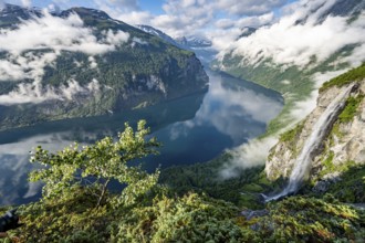 Gjerdefossen waterfall, at Ørnesvingen viewpoint, atmospheric clouds over the fjord in the morning