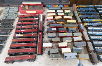 Model railway toy train set items on display for sale at auction room, UK