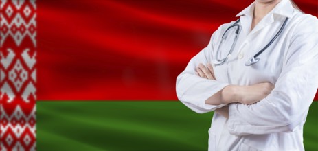 Doctor with crossed arms on Belarus flag. Belarus health and care concept. Female doctor on Belarus