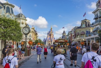 Horse pulling trolley car with Disney characters down Main Street in the Magic Kingdom at Walt