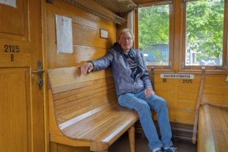 Passenger in the historic compartment of the Prussian train steam railway Minden Germany