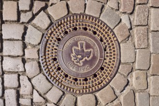 Manhole cover, dove of peace, 350 years of the Peace of Westphalia, 1648 to 1998, biblical symbol,