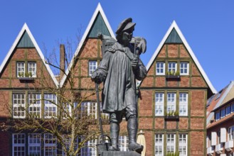 Kiepenkerl monument, bronze sculpture, brick architecture, facade, window, depth of field, blue