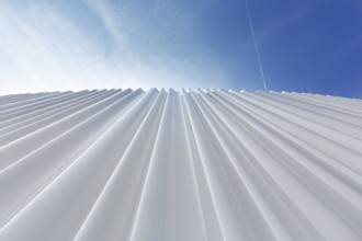 Modern white façade made of corrugated acrylic glass, Plexiglas, SANAA production hall, architect