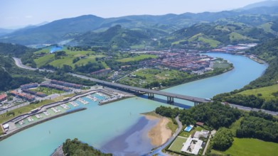 Aerial view of orio, a charming town in gipuzkoa, basque country, spain, showcasing the river,
