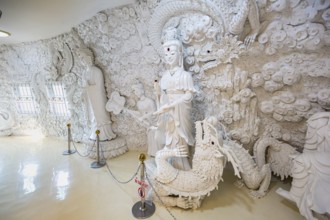 Ornate carvings on the walls at the Guan Yin (Goddess of Mercy) statue at Wat Huay Pla Kang Temple