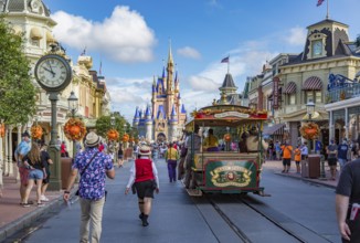 Horse pulling trolley car with Disney characters down Main Street in the Magic Kingdom at Walt