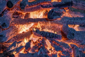 Embers burning in a bonfire during a religious festival in honor of Saint John in Brazil, Minas