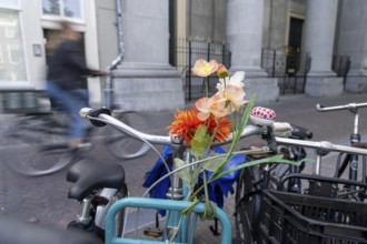 Cycling in the Netherlands, Utrecht, parked bike with flower decoration on the handlebars