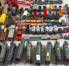 Model railway toy train set items on display for sale at auction room, UK