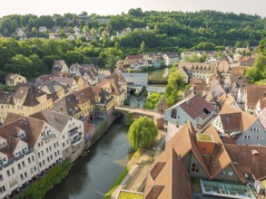 Idyllic old town with a river and green landscape in the background, Calw, Black Forest, Germany,