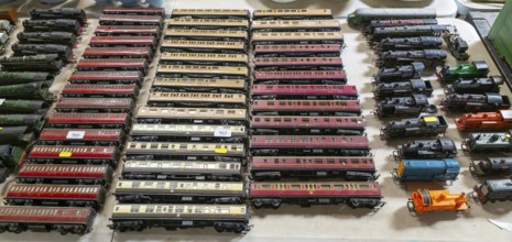 Model railway toy train set items on display for sale at auction room, UK