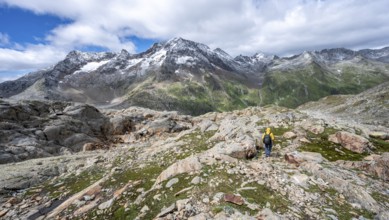 Mountaineer on hiking trail, rocky mountain landscape, behind mountain peak Roter Knopf with fresh