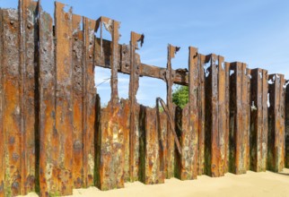 Old rusty broken steel sheet piling sea wall coastal defence, River Deben, Bawdsey, Suffolk,