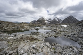 Small mountain lakes in a rocky mountain landscape, Niedere Gradenscharte, behind the summit of the