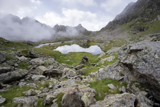 Mountain landscape with mountain lakes Wangenitzsee and Kreuzsee, cloudy mountain peaks in the