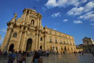 Cathedral of Syracuse, shot of the baroque cathedral from a distance with a busy square under a